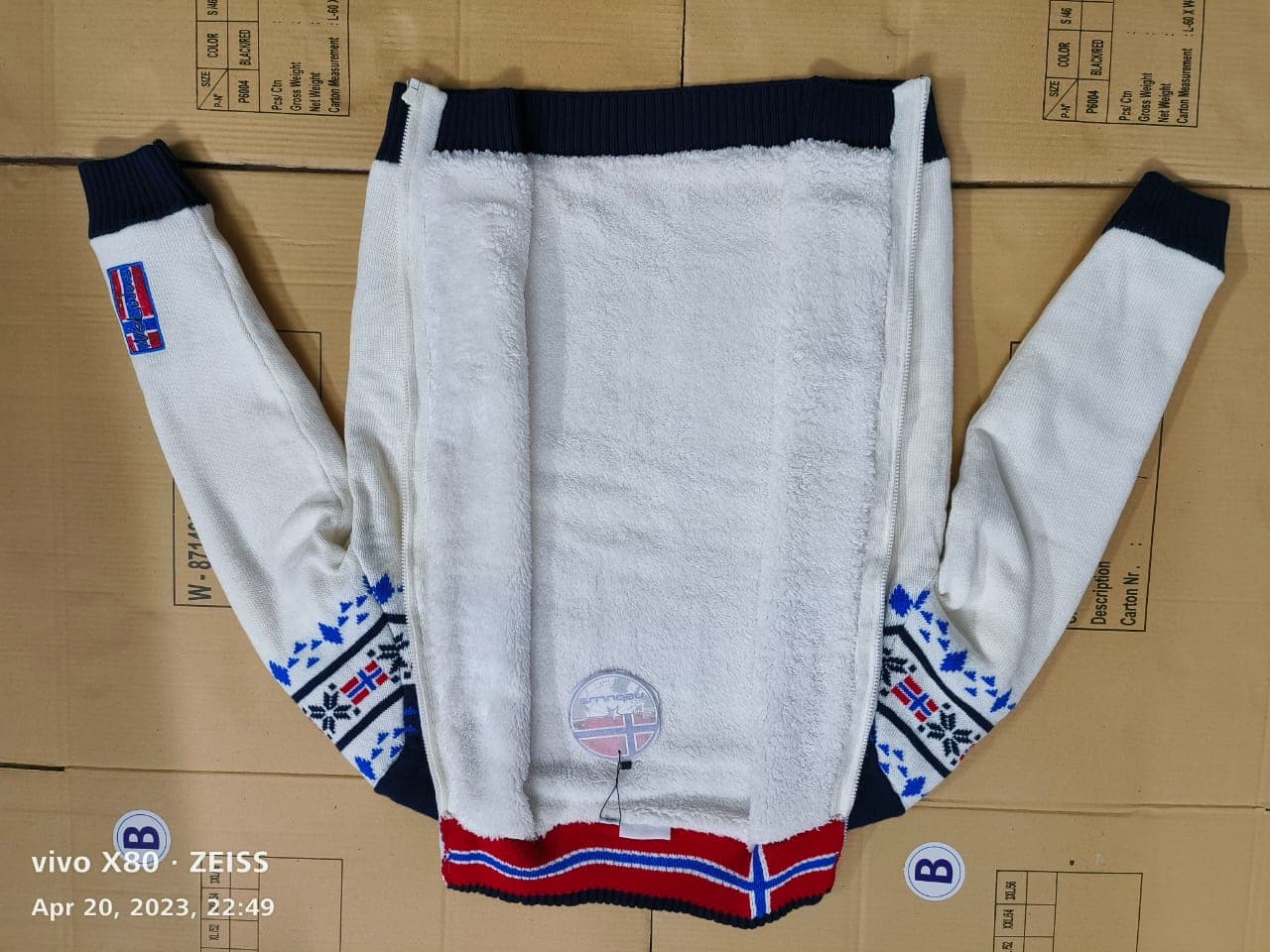 Inside of a full-zip sweater showing a sherpa fleece lining